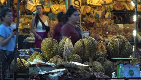 Medium-Exterior-Shot-of-Durian-Street-Vendors-Stall-at-Night