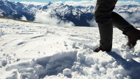 Hiking-along-in-deep-snow-in-the-mountains-with-mountain-boots