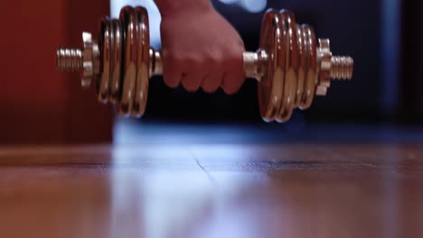 Exercising-at-home-by-lifting-weights-using-dumbbell-02