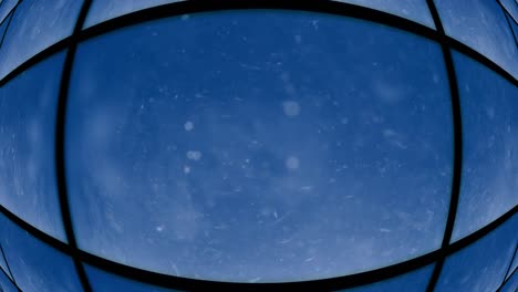 Abstract-blue-globe-window-with-particles-floating-by