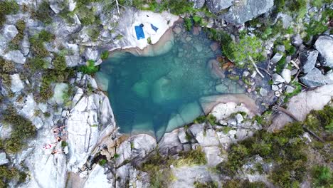 Small-blue-lagoon-created-from-waterfall-in-Peneda-Geres-National-Park,-Portugal,-Europe