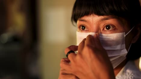 Nurse-at-the-Parque-das-Tribos-community-for-indigenous-people-puts-on-a-face-mask-before-treating-COVID-19-patients