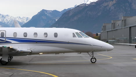Cessna-Citation-Private-jet-parking-in-front-of-the-alps,-Sion-Airport