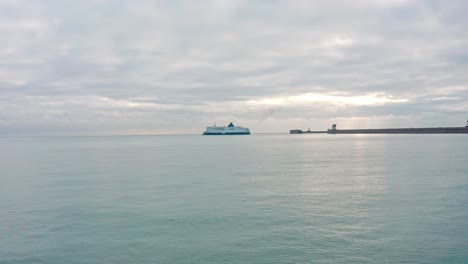 Low-aerial-drone-shot-towards-Dover-to-calais-cross-channel-ferry-leaving-dover-harbour