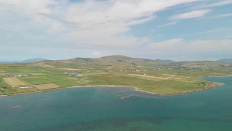 Long-sweeping-aerial-video-of-Valentia-Island,co-kerry-home-to-the-first-transatlantic-communications-cable-connecting-Europe-with-North-America,video-rests-with-Portmagee-in-foreground-
