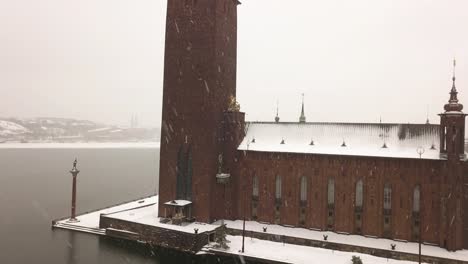 Establishing-shot-of-historic-City-Hall-in-Stockholm,-Sweden-on-cold-winter's-day