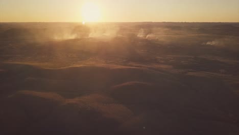 Aerial-Drone-flying-over-vast-Australian-Desert-into-smokey-bush-fire