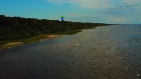 Wider-view-from-above-of-a-kite-surfer-riding-the-waves