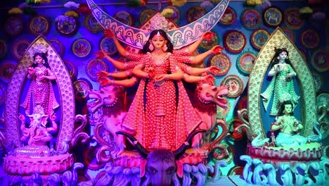 Decorated-Idol-of-Hindu-Goddess-Durga-with-multicolored-lights-and-decorations-and-sculptures-of-other-Gods-and-Goddesses