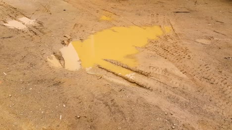 Puddle-of-mud-with-water-and-dirt-filmed-in-UHD-4k