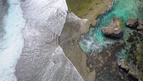 Aerial-dolly-over-Magpupungko-Rock-Pools-at-high-tide-at-Siargao,-the-Philippines