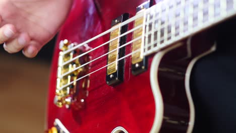 Closeup-of-a-hand-playing-a-bass-guitar-slapp-style