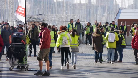 Yellow-jacket-protesters-dancing-in-the-middle-of-the-street-before-the-beginning-of-a-demonstration-in-Marseille,-south-of-France