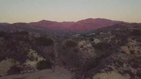 Flying-towards-purple-California-mountains-during-sunset