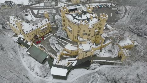 Aerial-View-Of-Hohenschwangau-flying-to-top-of-the-castle-in-winter