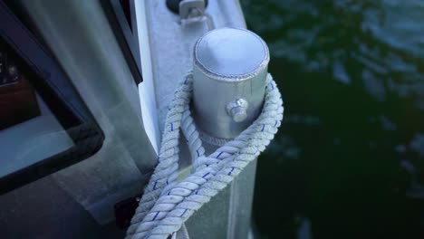 Boat-tied-with-mooring-rope-knot-on-bollard