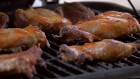 Seasoned-chicken-cooks-on-the-backyard-grill