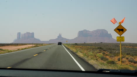 Driving-on-the-highway-towards-monument-valley-on-a-beautiful-summer-day