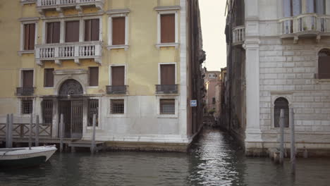 Sailing-near-small-Canal-in-Venice,-Italy