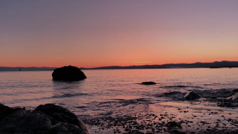Calm-ocean-beach-in-warm-twilight,-Victoria