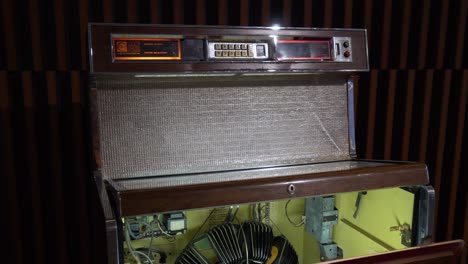 Close-view-of-an-opened-vintage-jukebox-from-the-70s