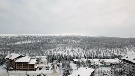Panning-drone-view-of-hotels-in-Saariselka,-Lapland,-Finland