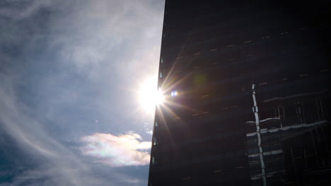 Sun-shining-through-a-large-modern-skyscraper