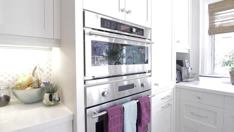 Stainless-steel-oven-in-a-modern-white-kitchen