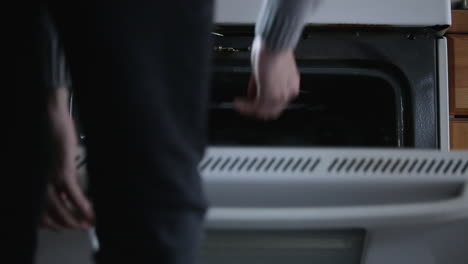 Taking-Tray-out-of-half-open-oven
