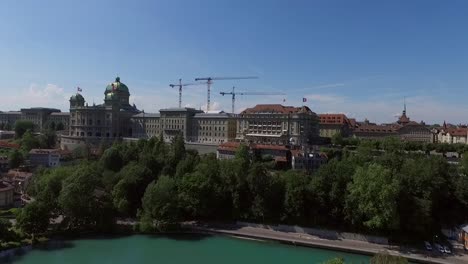 rising-drone-shot-of-the-Federal-Palace-of-Switzerland,-House-of-Parliament,-the-Bundeshaus-of-Bern-the-capital-of-Switzerland-AERIAL-SHOT