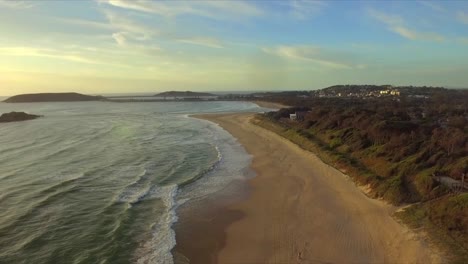 Aerial-drone-travelling-shot-over-the-beach-towards-Coffs-Harbour