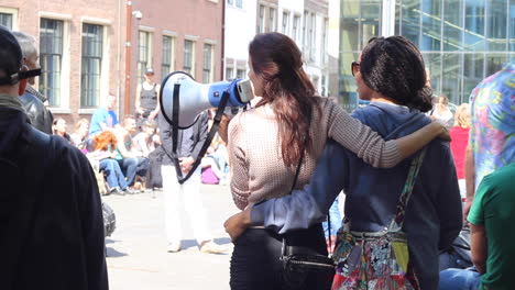 Woman-speaking-into-a-megaphone-at-a-protest-against-the-use-of-GMO-in-food