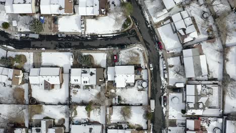 Drone-top-view-of-snow-covered-neighborhood