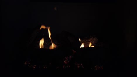 This-is-a-video-of-a-gas-fireplace-with-a-fire-burning-in-it