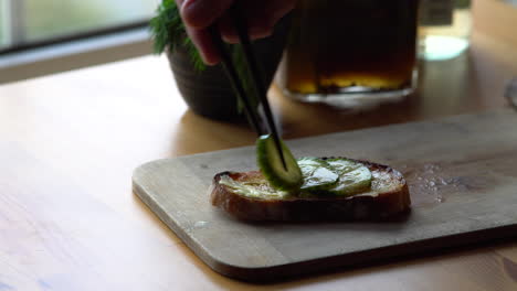 Sliced-of-picked-cucumber-on-toasted-bread
