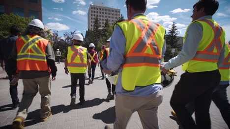 Group-of-construction-workers-walking-towards-a-job-site