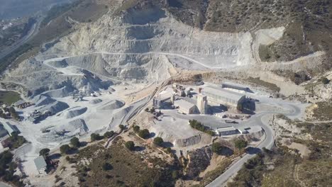 Aerial-view-over-a-big-quarry-in-a-mountain