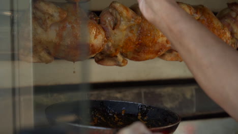 Rotisserie-chicken-slowly-rotating-in-the-oven