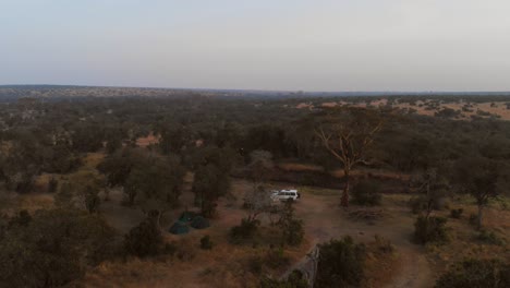 Sunrise-near-a-river-and-campsite-in-Ol-Pejeta,-Kenya
