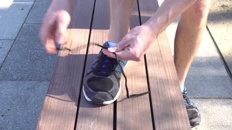 A-runner-is-tying-his-shoes