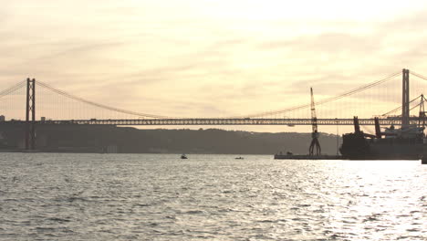 View-to-the-25Th-April-Bridge-Tejo's-River-with-the-road-traffic-at-the-sunset