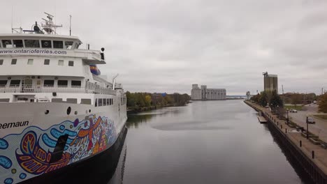 Drone-footage-at-the-front-bow-of-the-Chi-Cheemaun-while-it-is-docked-in-Owen-Sound,-Ontario
