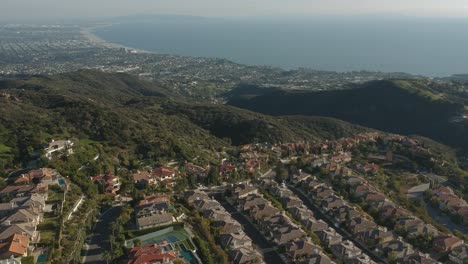 Midday-camera-down-drone-sightseeing-view-from-the-garden-city-of-Malibu,-California