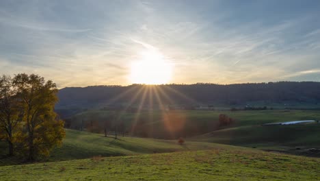 This-video-is-a-timelapse-of-the-sun-setting-behind-the-mountains-on-a-farm-in-Lewisburg,-West-Virginia-in-fall-time