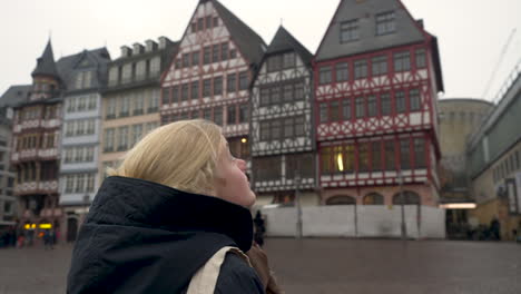 Slow-Motion-shot:-Woman-looking-around-Frankfurt's-Old-Town-Center