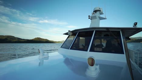 SLOWMO---Cabin-cruiser-boat-in-Marlbourough-Sounds,-New-Zealand-during-evening