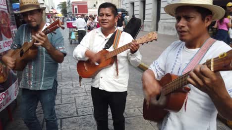 Wide-shot-showing-all-three-mariachi-musicians-and-singers