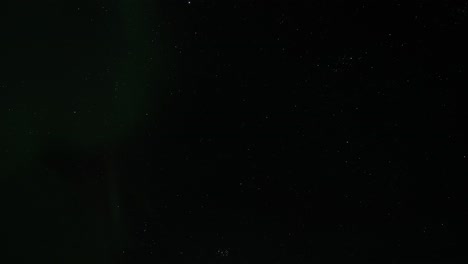 Dramatic-pan-shows-beautiful-northern-lights-in-Iceland-in-February