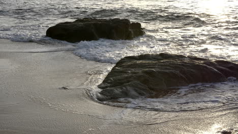 Calming-Serenity,-Ocean-Swell-Over-Rocks-at-Sunset,-4K