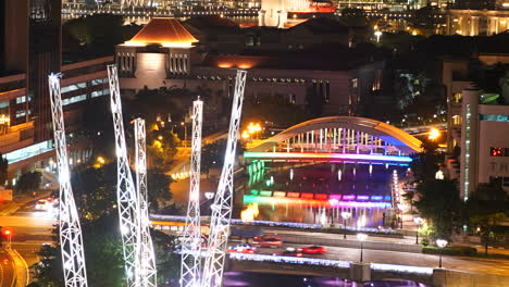 Singapore---Circa-Pan-up-time-lapse-in-downtown-Singapore-at-night,-with-flashing-lights-and-fast-moving-traffic